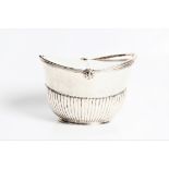 A George III silver tea caddy of basket oval form with two compartments with locks, and marks for
