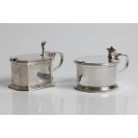 Two silver mustard pots, one blue glass lined, one with spoon, both with marks for London 1929 and