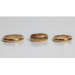 A 9ct yellow gold band ring, ring size U, approx. weight 4.5gms, a 9ct yellow gold textured yellow