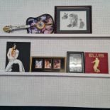 A collection of Elvis Presley memorabilia to include two wall clocks, one in the form of a guitar,