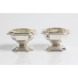 A pair of glass lined silver salts with marks for Britannia London 1912 and Lionel Alfred Critchton.