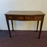 A reproduction mahogany two drawer cutlery side table. IMPORTANT: Online viewing and bidding only.