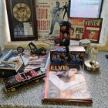 A collection of Elvis Presley memorabilia including Bradford Exchange figure on podium light,