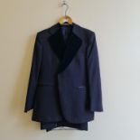 A blue three piece suit by Christian Dior, trouser size waist 38 length 30, with velvet collar trim.