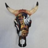 A cows skull and horn painted with a Native American chief. IMPORTANT: Online viewing and bidding