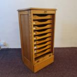 A golden oak tambour front filing cabinet. IMPORTANT: Online viewing and bidding only. Collection by