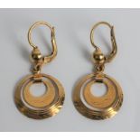 A pair of circle dropper earrings, marked 18ct gold, approx. weight 4.6gms. Important: Online