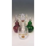 Eight glass decanters with toppers, one inscribed Jack Daniels Old No. 7, one green and one