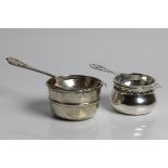 Two silver tea strainers, one with marks for Sheffield 1959 and 1963 and Emile Viner, one with marks