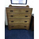 An arts & crafts style four drawer chest with hand beaten copper handles. IMPORTANT: Online