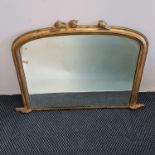 A 19th century gilded arch topped mantel mirror with leaf design to top. IMPORTANT: Online viewing