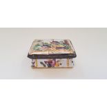 A hand painted enamel pill box with peacock design to top and floral design to sides. Important: