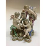 Meissen figure group, three cherubs, one painting on easel, with crossed swords mark to base, AF,