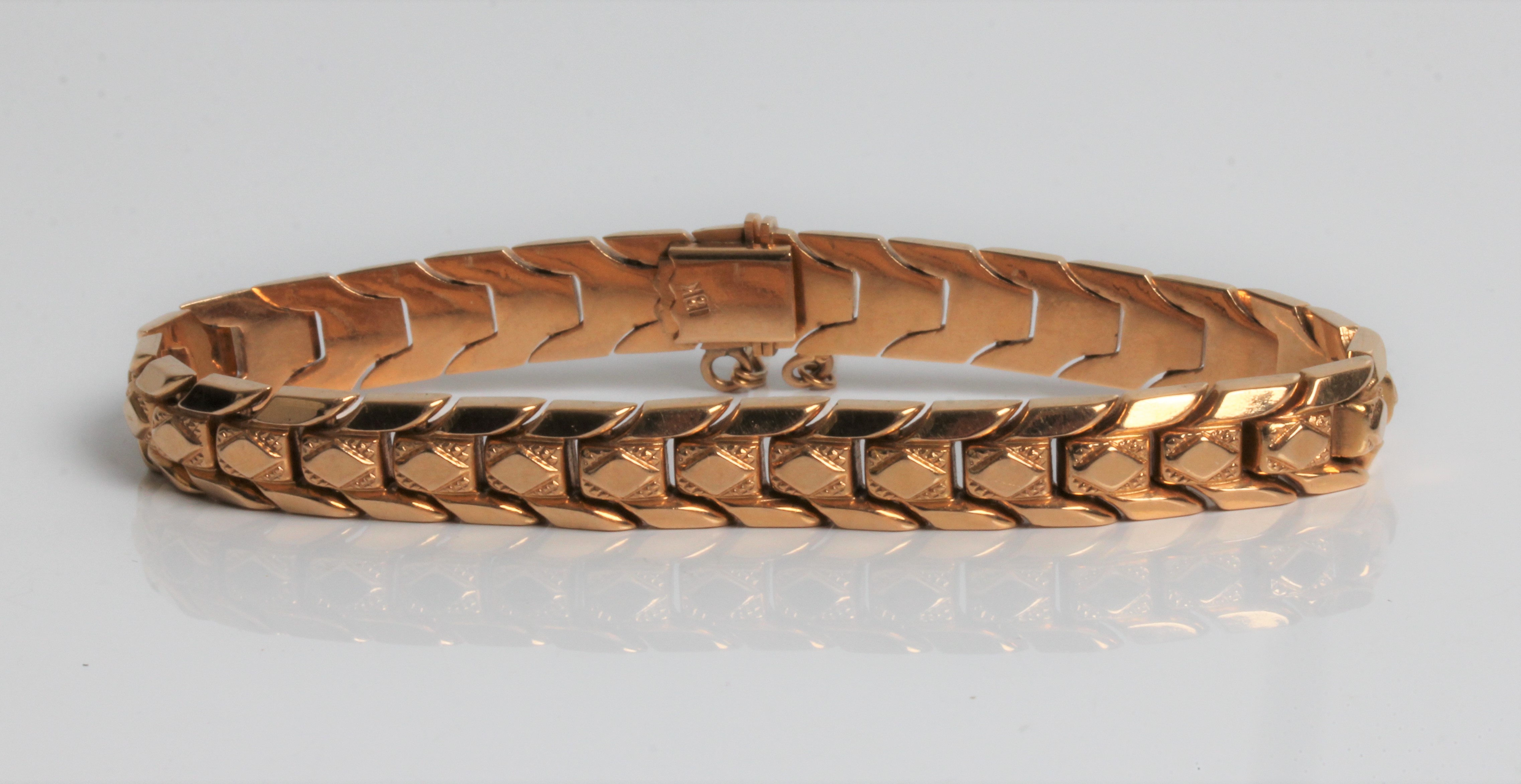 A yellow gold articulated bracelet, marked 18k, approx. length 18cms, approx. weight 16.9gms.