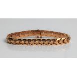 A yellow gold articulated bracelet, marked 18k, approx. length 18cms, approx. weight 16.9gms.