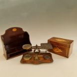 A small mahogany box, with a set of brass scales and a set of miniature mahogany bookshelves.