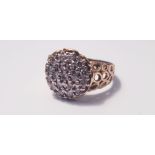 A yellow gold18ct diamond cluster ring of domed form set with 19 small diamonds, ring size R,