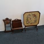 A Waring & Gillows mahogany magazine rack with an embroidered and glazed fire screen table and an