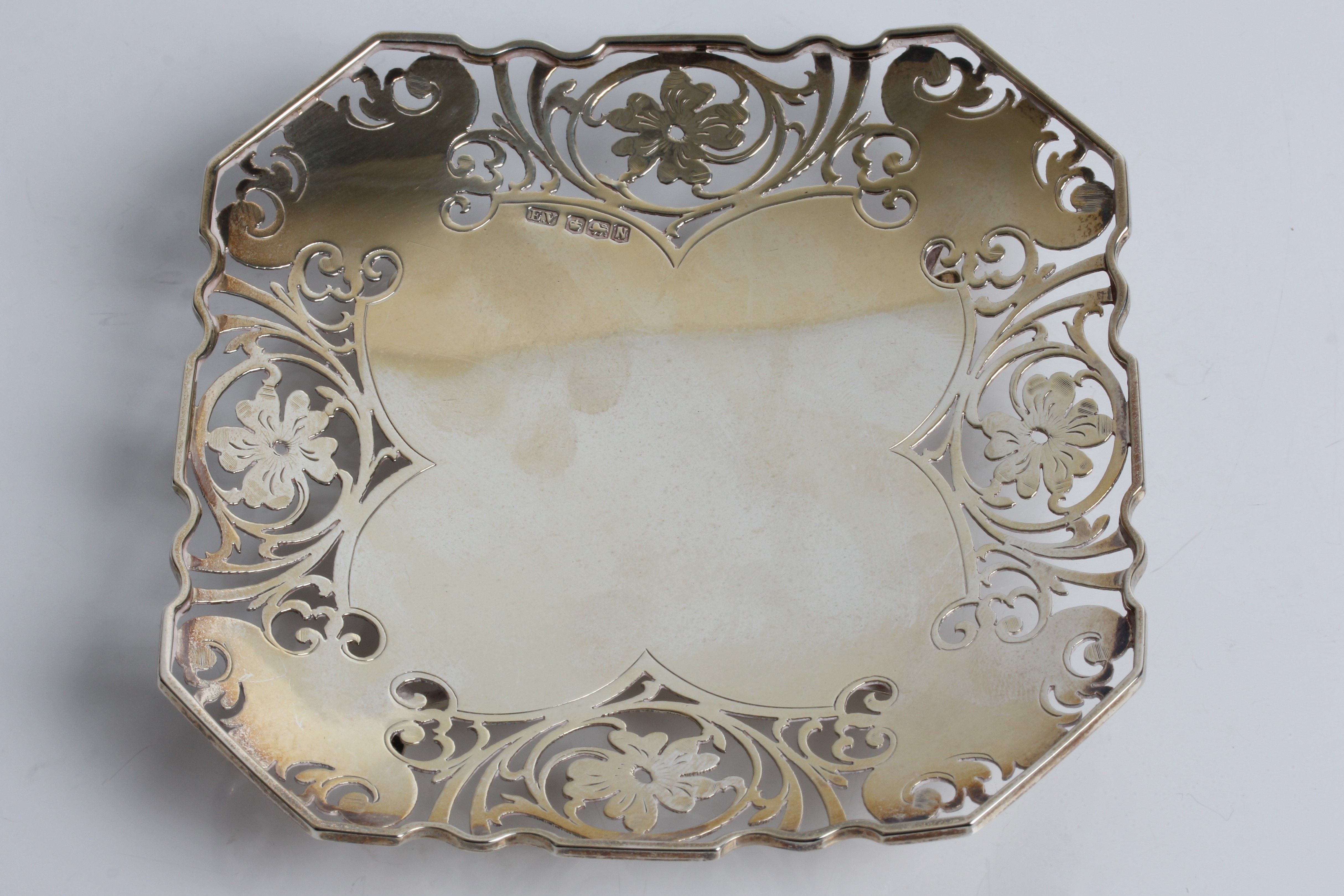 A silver card tray with pierced floral decoration, with marks for Sheffield 1955 and Viner's Ltd (