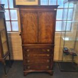 A Longdale distressed mahogany reproduction cocktail cupboard with single drawer and single door