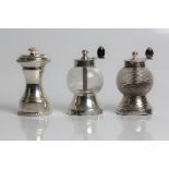 Silver and glass salt and pepper mills, with marks for Birmingham 1896 and Hukin & Heath, 9cm x