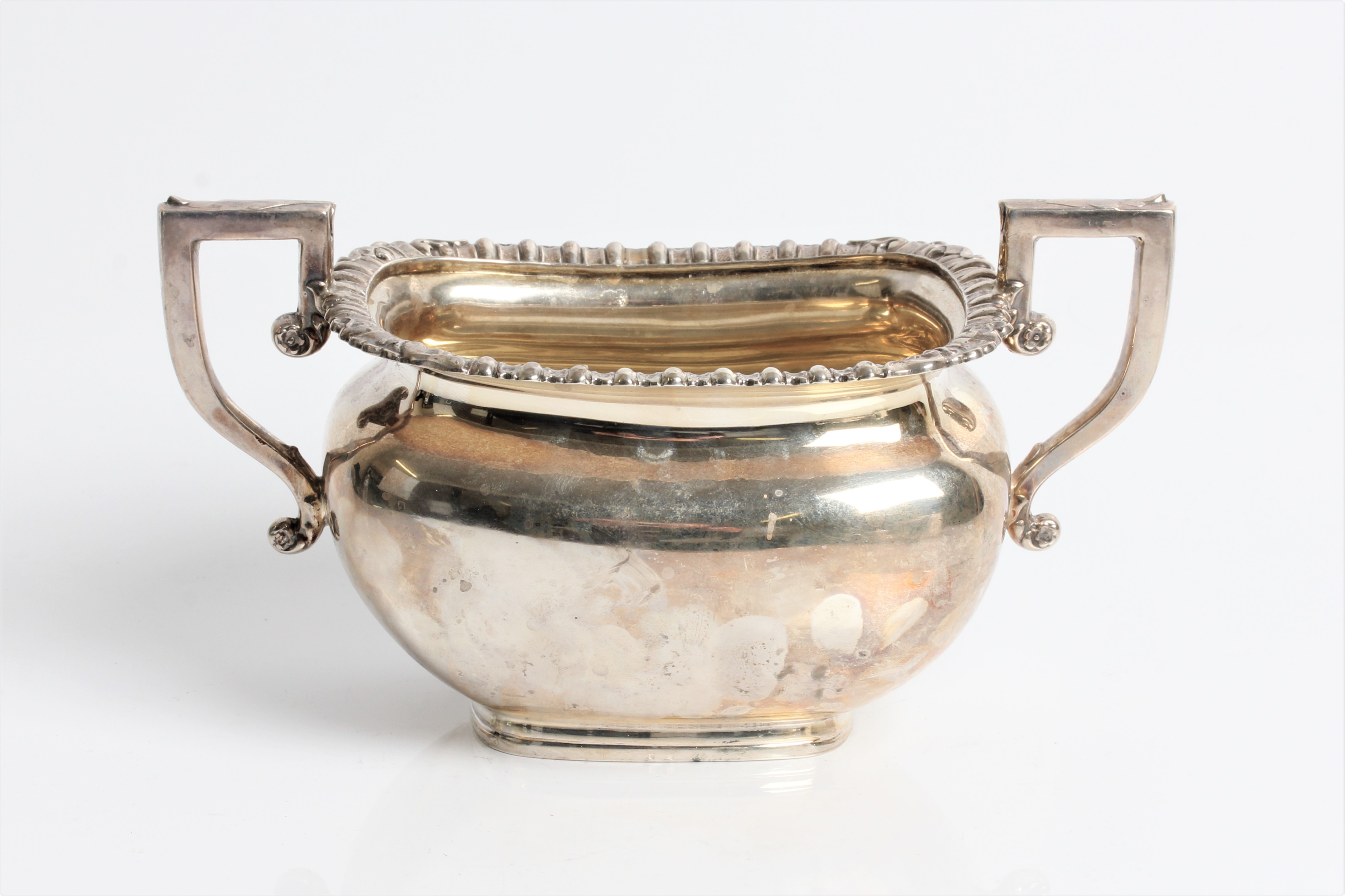 A silver twin handled sugar bowl with marks for Chester 1921/22, approx. weight 260gms. Important: