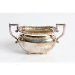 A silver twin handled sugar bowl with marks for Chester 1921/22, approx. weight 260gms. Important: