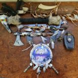 A collection of Native American related items including a war dance rattle, a quill and arrows,