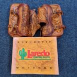 A leather tooled saddle bag, with a pair of Laredo Western boots size 9.5, boxed. Important: