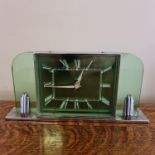 A Smiths 8 day green glass and chrome base Art Deco clock. Important: Online viewing and bidding