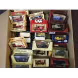 A box containing various boxed model vehicles including Models of Yesteryear, Days Gone and other