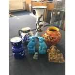 A selection of ornaments to include a pair of foo dogs, vase with dragon to front, orange vase, jug,