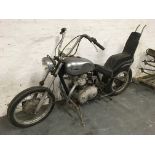 A Triumph 1980 744 cc motorcycle with chrome petrol tank, raised chopper style handle bars and a