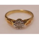 A hallmarked 18ct yellow gold diamond solitaire ring, illusion set with a round brilliant cut