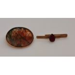 A hallmarked 9ct yellow gold garnet set tie slide, weighing approx. 5.4g, together with a moss agate