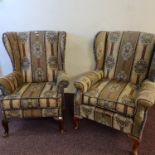 Two striped upholstered fireside wing back armchairs. IMPORTANT: Online viewing and bidding only.