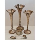 A collection of hallmarked silverware, to include a pair of weighted posey vases and another of