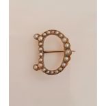 A seed pearl initial 'D' brooch, set with graduated seed pearls to design, unmarked yellow metal,