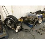 A classic Triumph chopper frame with some spare parts attached. IMPORTANT: Online viewing and
