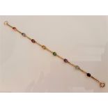 A multi-gemstone bracelet, the curb link chain bezel set with various oval cut gemstones to