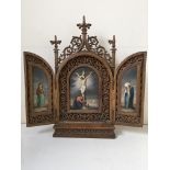 A portable triptych with central scene of Christ on cross, flanked by the Virgin Mary and Mary in