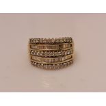 A hallmarked 9ct yellow gold five row diamond half eternity ring, set with five rows of alternating