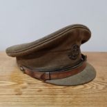 *An Officers Middlesex regiment peak cap with regiment badge and leather strap to front.