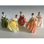 Five Royal Doulton figurines, Tender Moment, Winter Welcome, Spring Song, Fair Lady and Fleur,