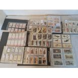 A large quantity of various cigarette cards in various albums.