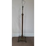 A brass finished heavy metal converted oil lamp stand. IMPORTANT: Online viewing and bidding only.