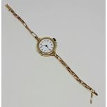 A hallmarked 9ct yellow gold cased ladies cocktail watch, the white dial having hourly Arabic