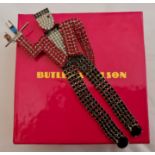 A Butler & Wilson waiter brooch, measuring approx. 14x7cm, in box. IMPORTANT: Online viewing and