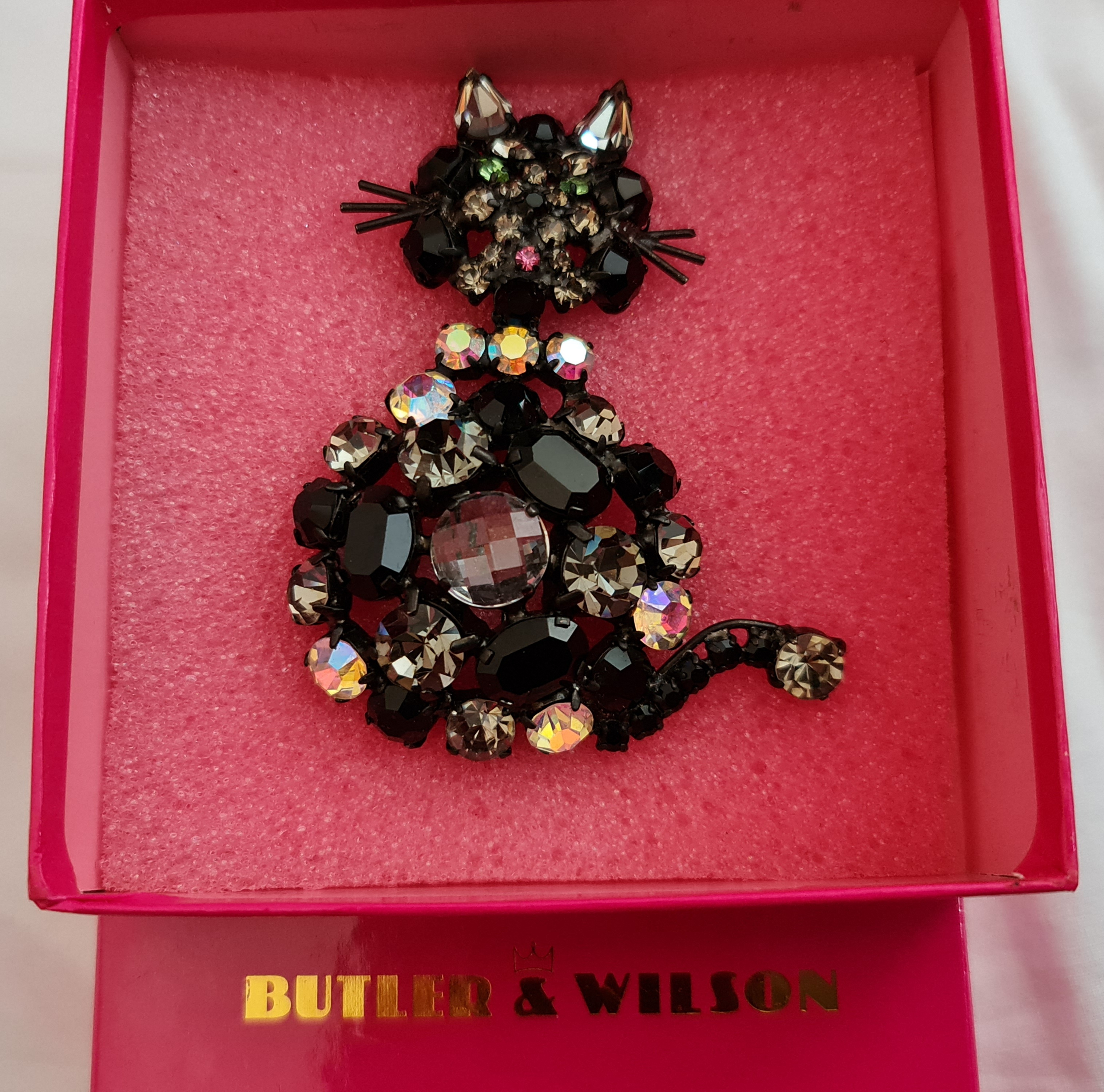 A Butler & Wilson cat brooch, measuring approx. 9x7cm, in box. IMPORTANT: Online viewing and bidding