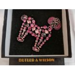 A Butler & Wilson poodle brooch, measuring approx. 13x12cm, in box. IMPORTANT: Online viewing and